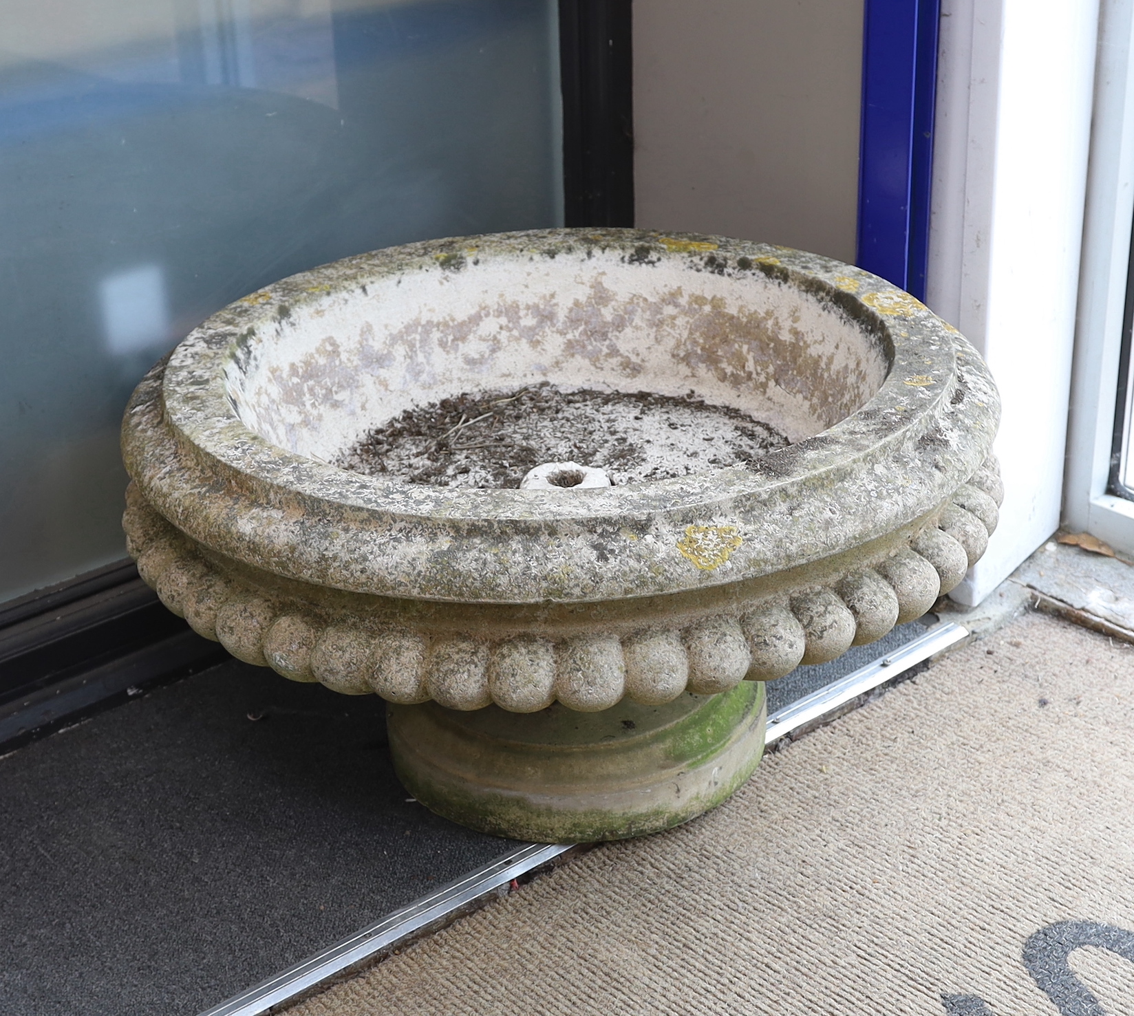 A pair of circular reconstituted stone garden planters, diameter 74cm, height 42cm